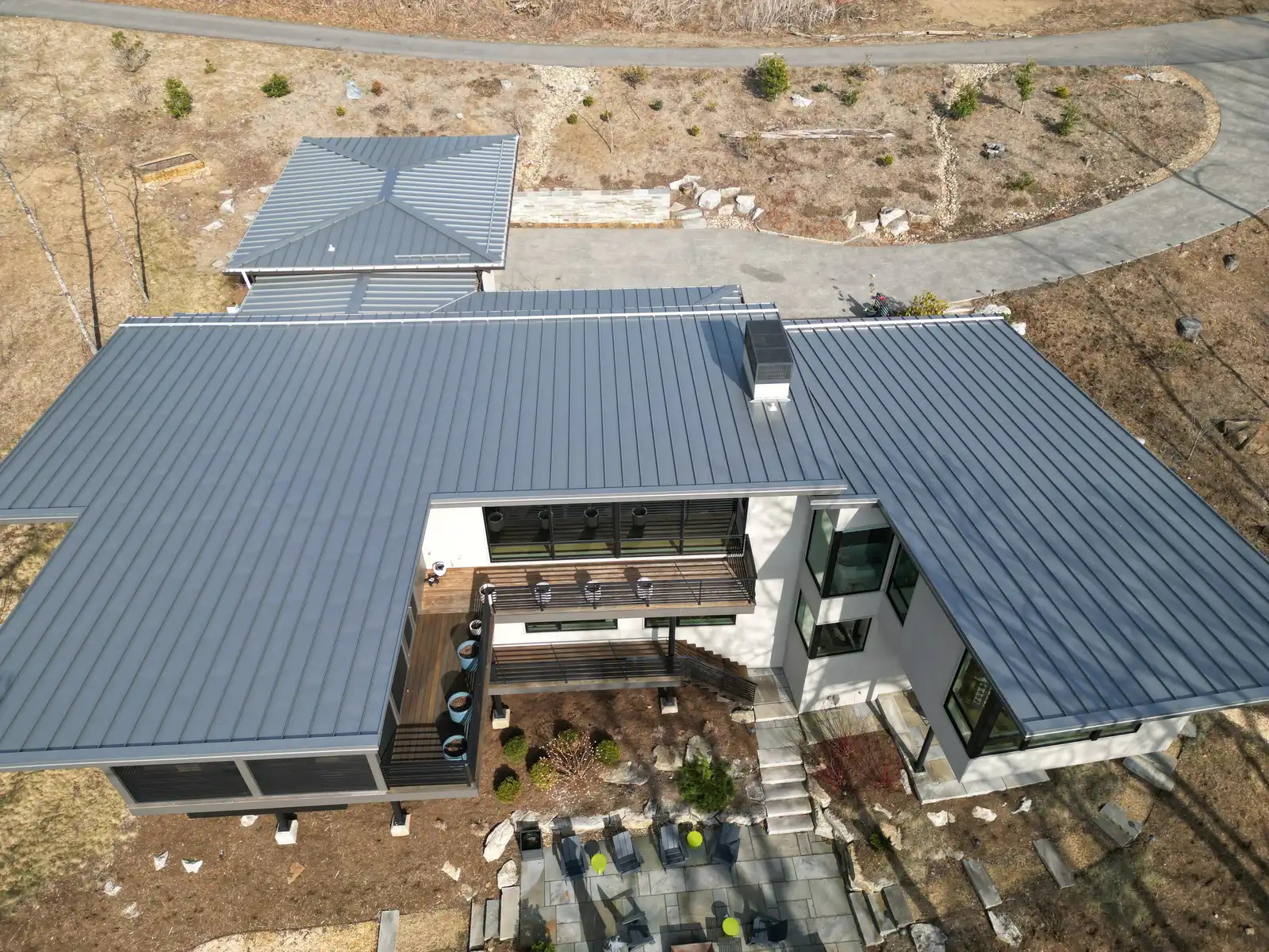 Aerial modern home standing seam metal roof